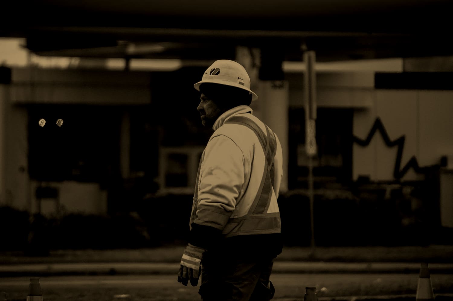 Construction worker in hi-vis gear on a Canadian roadside
